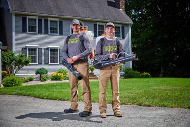 A couple of men holding equipment