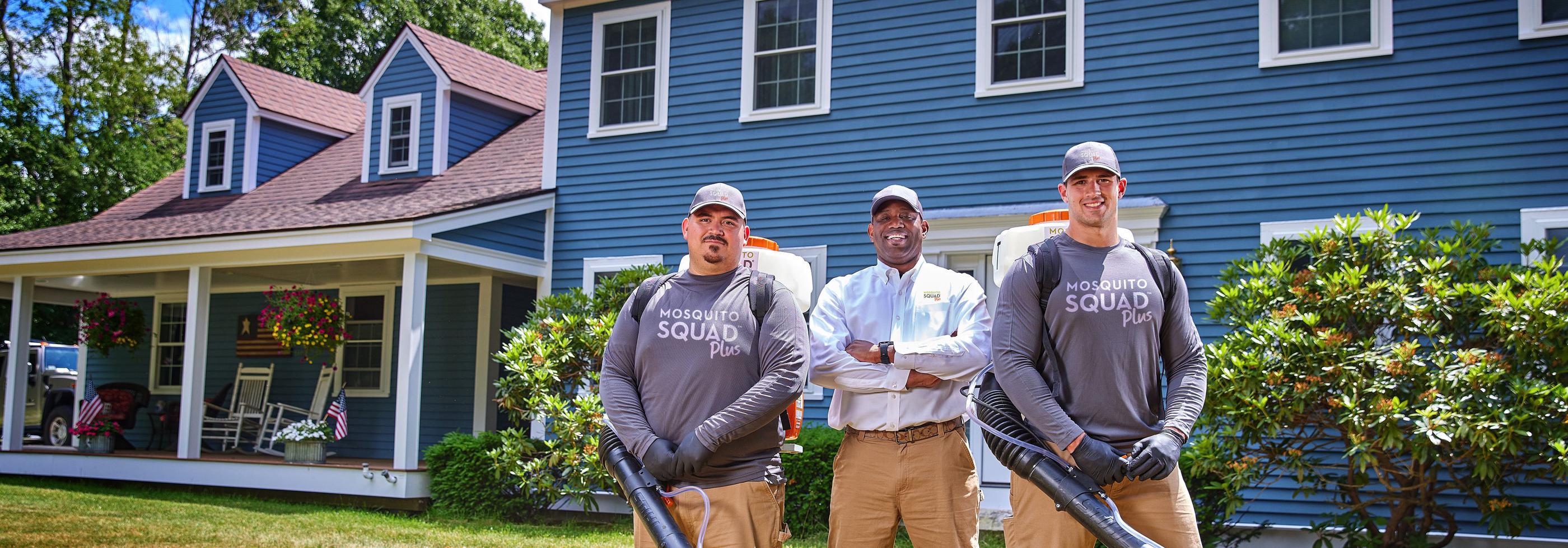 Three Mosquito Squad employees standing together